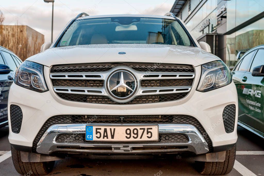 PRAGUE, THE CZECH REP., NOVEMBER 27, 2016: Closeup of new luxury cars Mercedes-Benz GLS class parking in front of car store. Detail front view of cars
