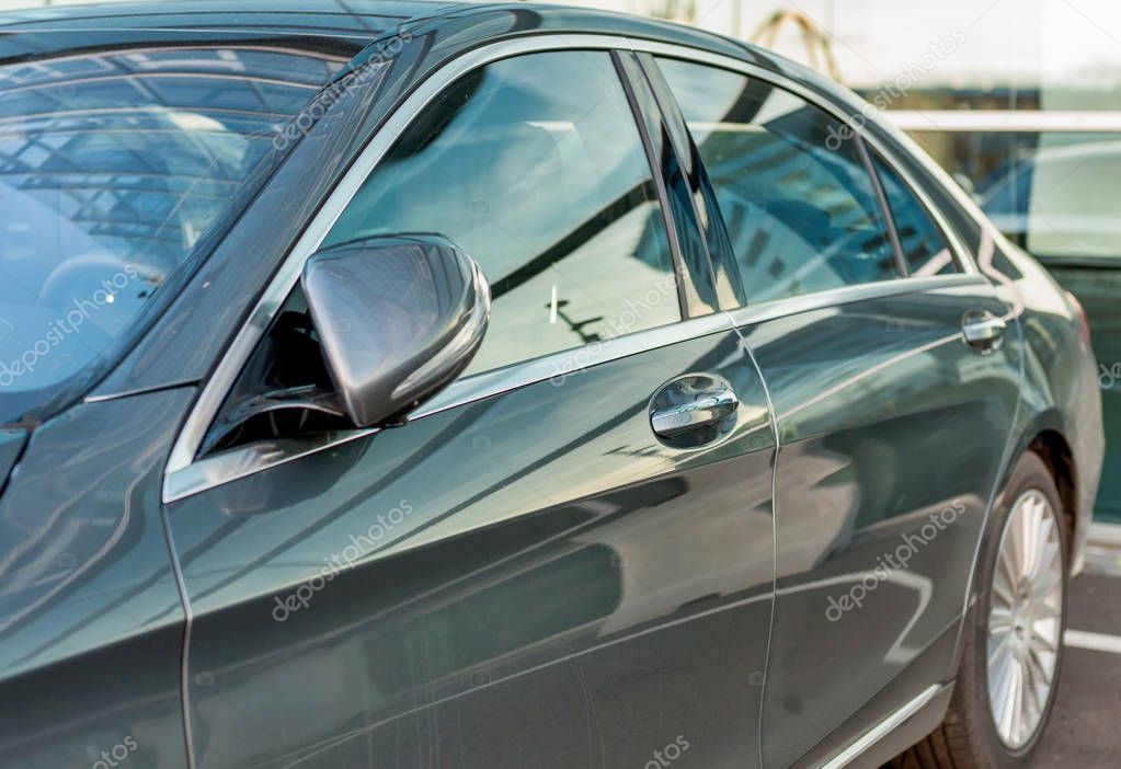 PRAGUE, THE CZECH REP., NOVEMBER 27, 2016: Closeup of new luxury car Mercedes-Benz S 350 d class, parking in front of car store. Detail front view of car