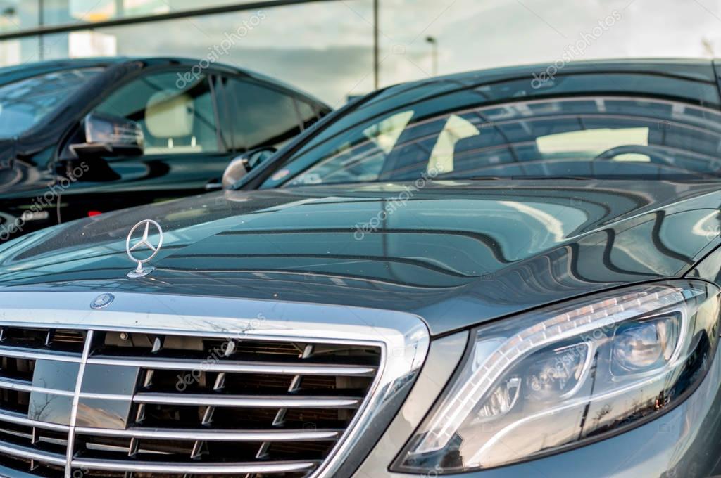 PRAGUE, THE CZECH REP., NOVEMBER 27, 2016: Closeup of new luxury car Mercedes-Benz S 350 d class, parking in front of car store. Detail front view of car