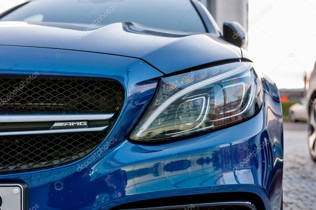 PRAGUE, THE CZECH REP., NOVEMBER 27, 2016: Closeup of new luxury car Mercedes-Benz c-class C63, parking in front of car store. Detail front view of cars