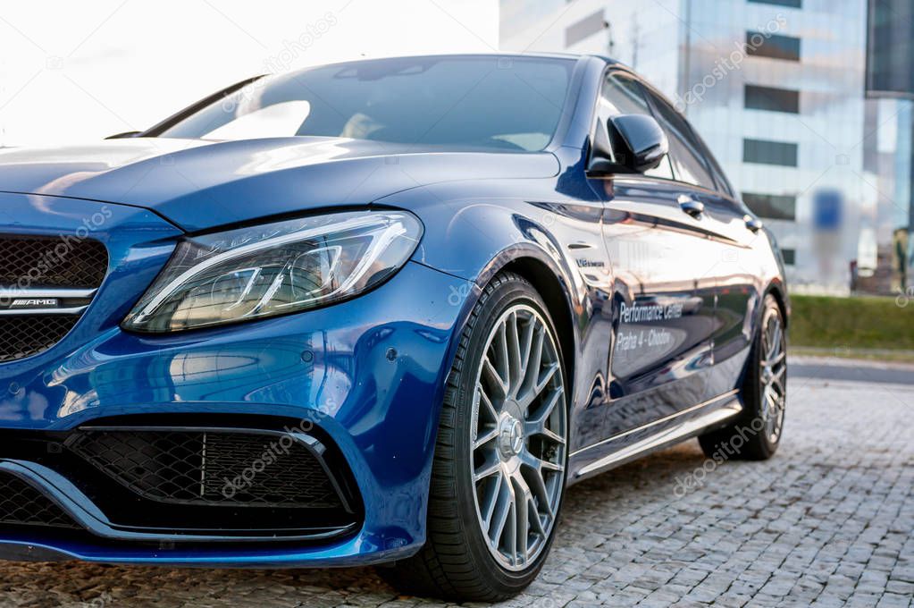 PRAGUE, THE CZECH REP., NOVEMBER 27, 2016: Closeup of new luxury car Mercedes-Benz c-class C63, parking in front of car store. Detail front view of cars