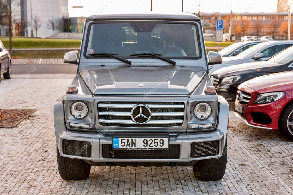 PRAGUE, THE CZECH REP., NOVEMBER 27, 2016: Closeup of new luxury car Mercedes-Benz G 350 d parking in front of car store. Detail of front view of car