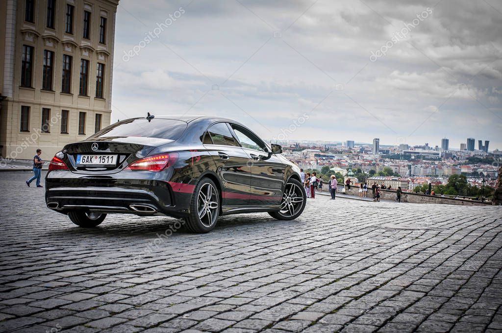 PRAGUE,THE CZECH REPUBLIC, 31.8.2017: Closeup of Mercedes Benz CLA 45 AMG, black car with red sports strips. Rare view of car