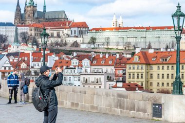 Prague, The Czech Republic, 14.3.2020: Asian tuorist with face masks. New type coronavirus 2019-nCoV pneumonia in Prague.