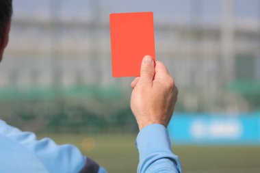 Football referee shows a red card. Disqualification. clipart