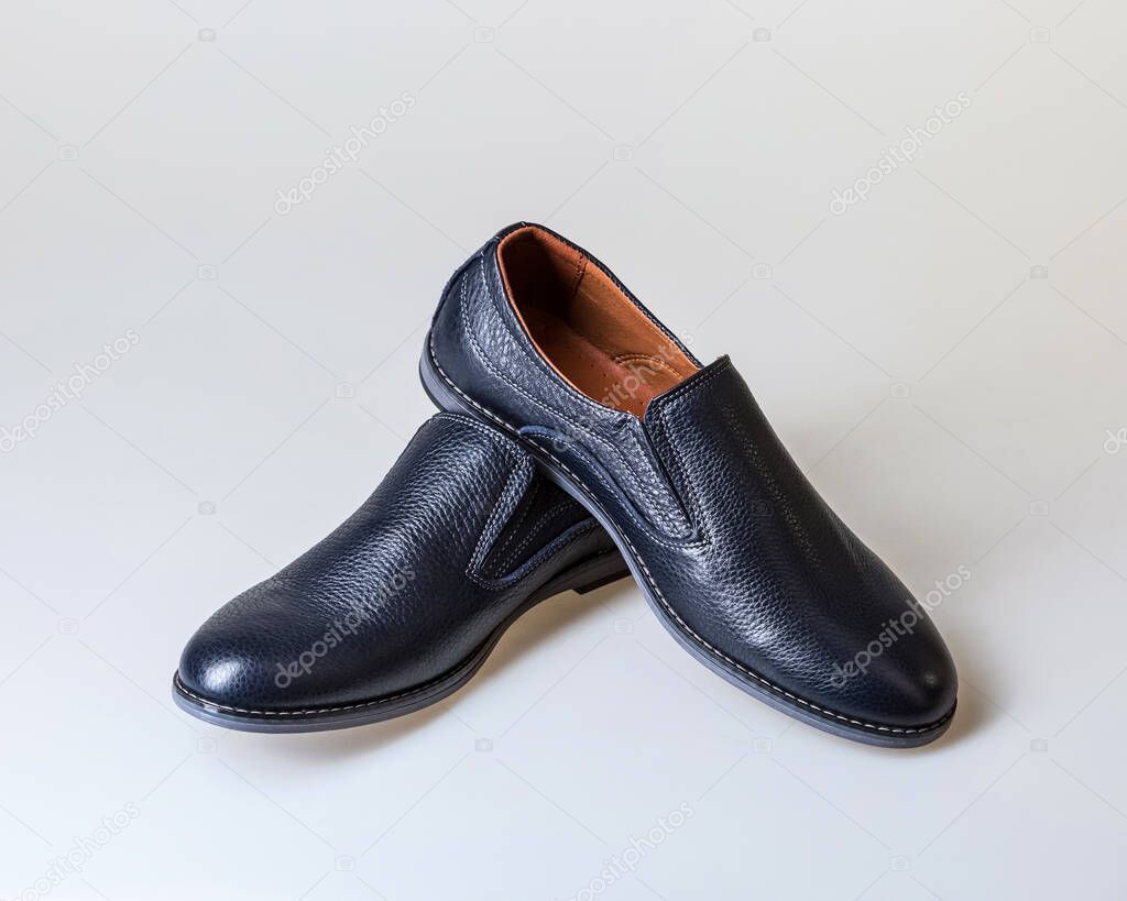 Men's leather shoes in blue. On white background.