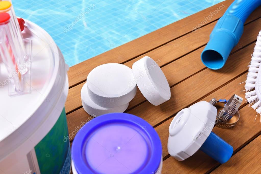 Chemical products and tools for pool maintenance elevated view