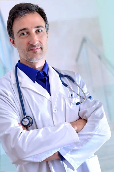 Caucasian general doctor with black clipboard half body vertical — Stock Photo, Image