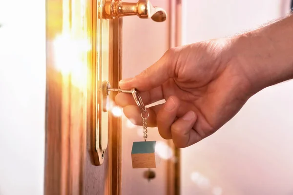 Hand that locks the door with light effect — Stock Photo, Image