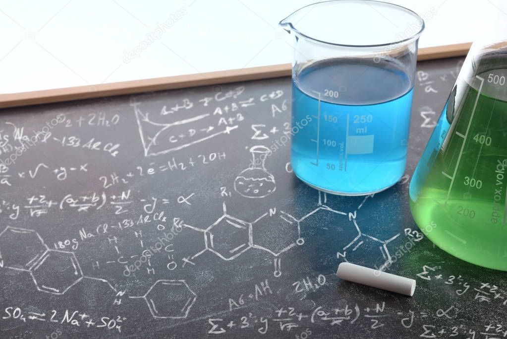 Chemistry teaching with drawn blackboard with chemical instrumen