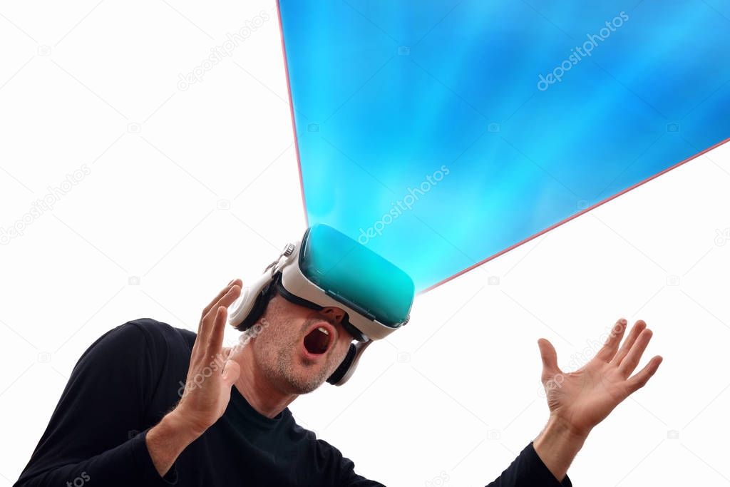 Man with vr glasses looking up and blue projection