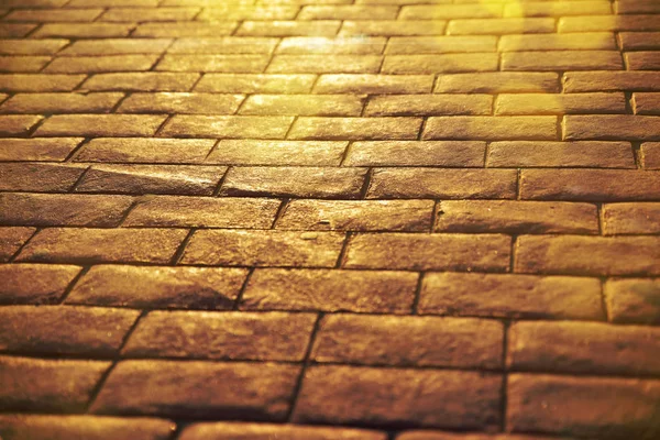 Straßenhintergrund aus Steinplatten mit Sonnenreflexion in Nahaufnahme — Stockfoto