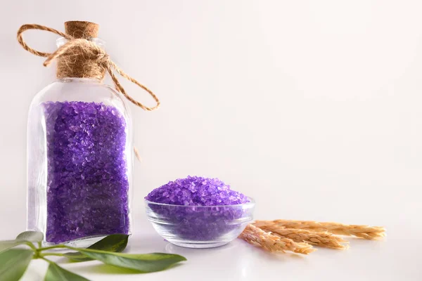 Lilac bath salts on white table and white isolated background — 스톡 사진