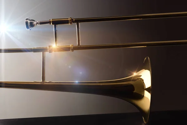 Backlit trombone on black base trombone concert concept with lights and dark background. Side view. Horizontal composition.