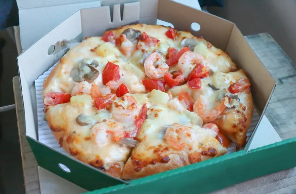 shrimp pizza in the box