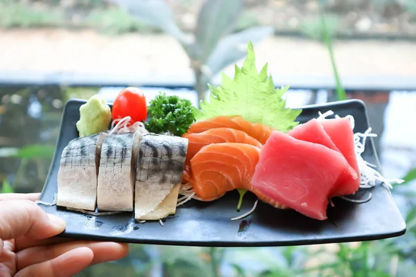 fish , raw salmon and raw tuna or sashimi