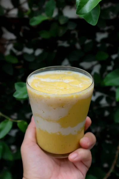 mango juice or mango smoothies with milk topping