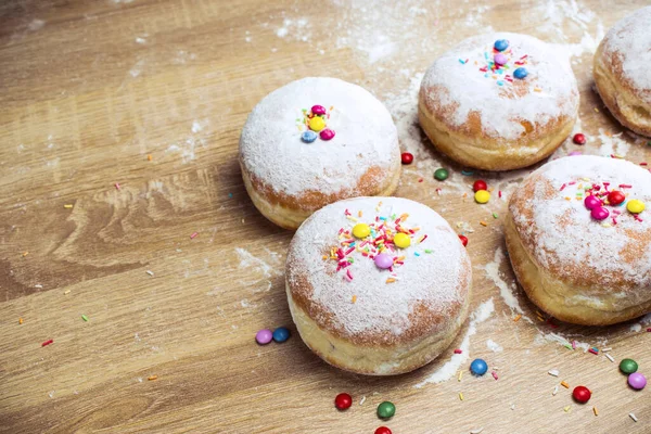 Cooking donuts. Delicious doughnuts on the table.