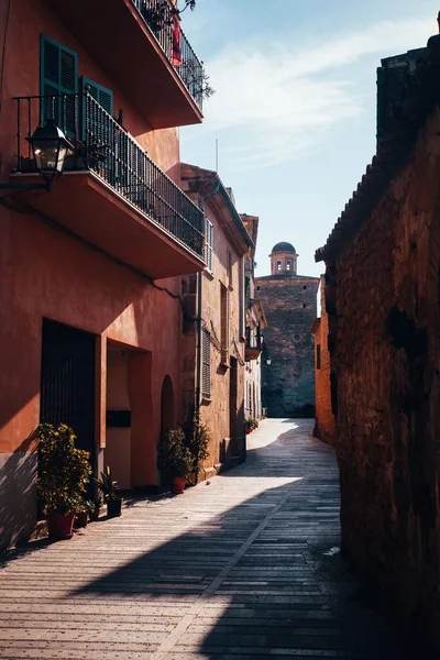 stock image One of the charming streets decorated with flowers in Alcudia, Majorca, Spain