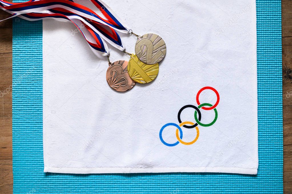TOKYO, JAPAN, JANUARY. 20. 2020: Medals and olympic flag. Olympic victory concept photo