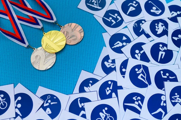 Blue Sports icons and medal set. Medal schedule concept photo. Original wallpaper for summer olympic game in Tokyo 2020