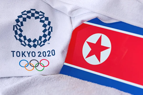 TOKYO, JAPAN, FEBRUARY. 4, 2020: North Korea National flag, official logo of summer olympic games in Tokyo 2020. White background — Stock Photo, Image