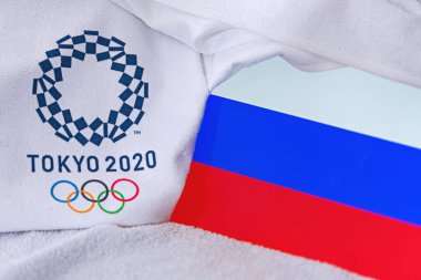TOKYO, JAPAN, FEBRUARY. 4, 2020: Russia National flag, official logo of summer olympic games in Tokyo 2020. White background clipart