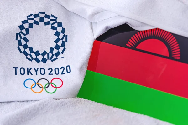 TOKYO, JAPAN, FEBRUARY. 4, 2020: Malawi National flag, official logo of summer olympic games in Tokyo 2020. White background — Stock Photo, Image