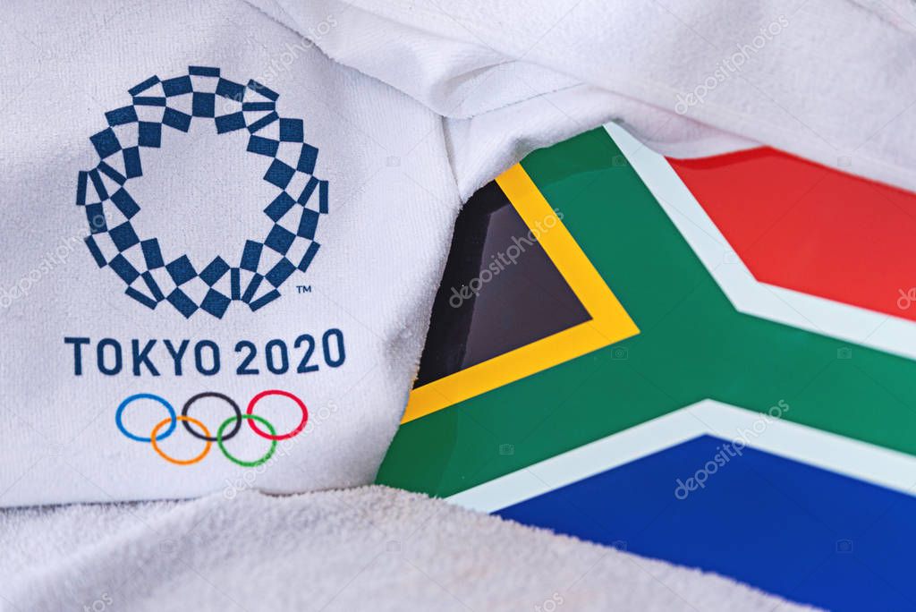 TOKYO, JAPAN, FEBRUARY. 4, 2020: South Africa National flag, official logo of summer olympic games in Tokyo 2020. White background