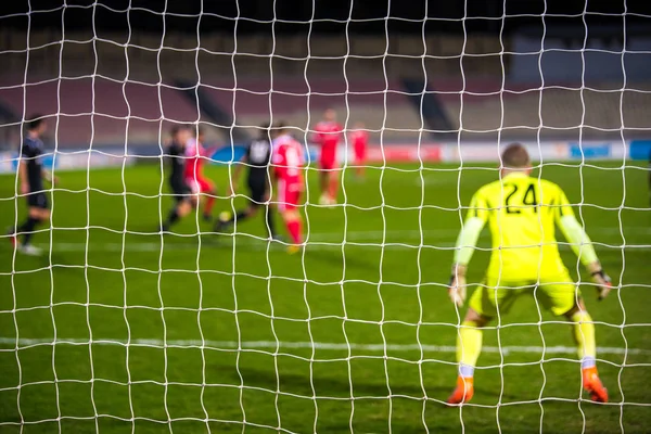 Fotboll, Fotboll foto - Fotbollsnät och fotboll i bakgrunden — Stockfoto