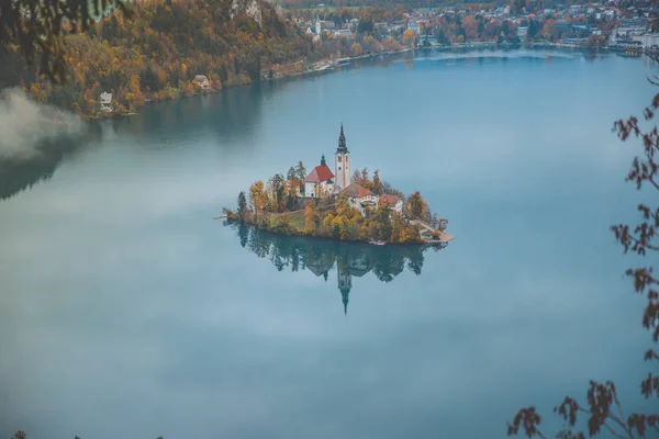 Autumn View On Bled Lake, Island, Church And Castle With Mountain Range — стоковое фото