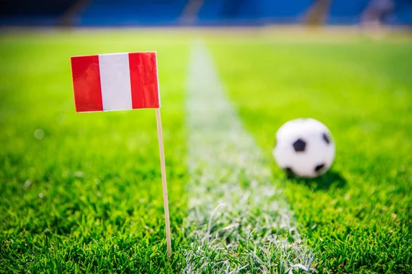 Peru national Flag and football ball on green grass. Fans, support photo, edit space
