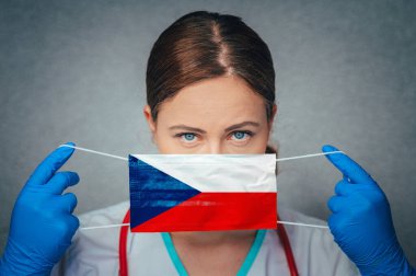 Coronavirus in Czechia, Czech Republic Female Doctor Portrait hold protect Face surgical medical mask with Czech Republic National Flag. Illness, Virus Covid-19 in Czech Republic, concept photo clipart
