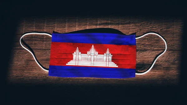 Cambodia National Flag Medical Surgical Protection Mask Black Wooden Background — Stock Photo, Image