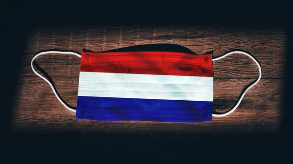 Netherlands National Flag Medical Surgical Protection Mask Black Wooden Background — Stock Photo, Image