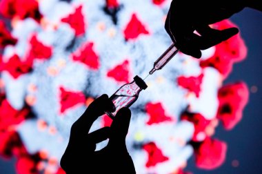 Coronavirus Covid-19 Koruma ve Aşı. Tıbbi eldiven mavi kalıp aşısı şırınga enjeksiyon tedavisi.