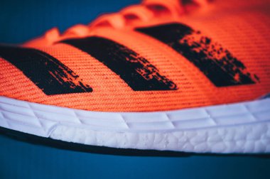 BRATISLAVA, SLOVAKIA - APRIL, 23, 2020: Adidas Adizero Boston 8 Running Shoes, version 2020, range Signal Coral color, Detail photo, Lightstrike foam and Adidas Ultra Boost. Kıtasal taban.