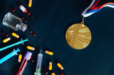 Gold medal and drugs, syringe and Medicine bottle for injection. Doping in sport, black edit space clipart