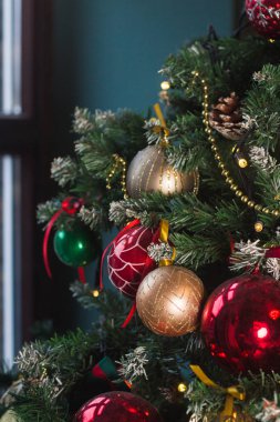 Beatiful christmas tree with balls, decorations and garlands