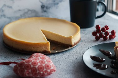 Cheesecake on a plate with strawberry sauce