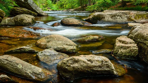 View of the mountain riverbed with large rocks and a rapid river. — Stock Photo, Image