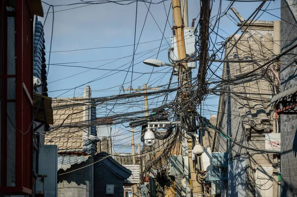 A tangle of cables hung on an electric pole in the old district, Hutongs.