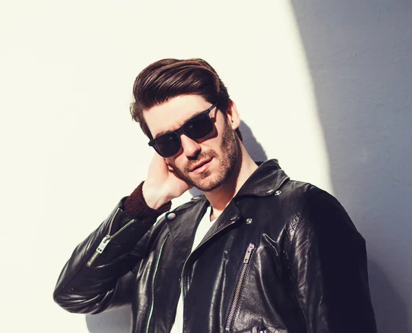 Sexy gorgeous stylish man in leather jacket