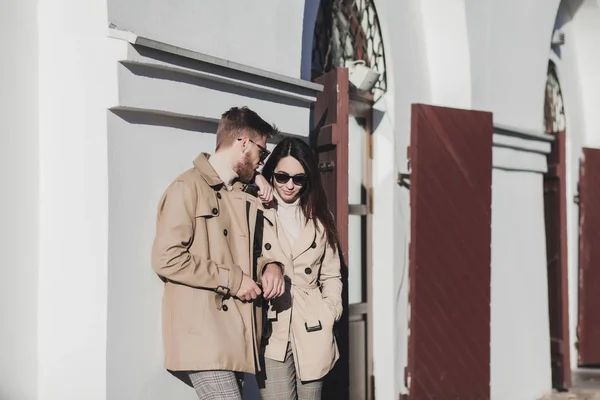 couple wearing trendy outfit and sunglasses