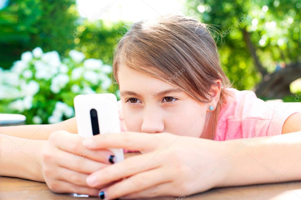 Teenage problems. Young girl addicted to social media technologi