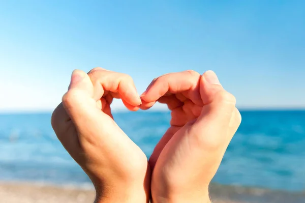 Composition finger frame- heart shaped young woman's hands — Stock Photo, Image