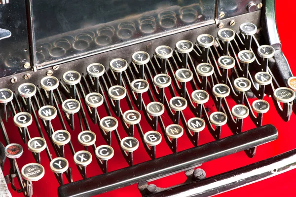 Old retro black metallic typewriter with antique round  keys. — Stock Photo, Image