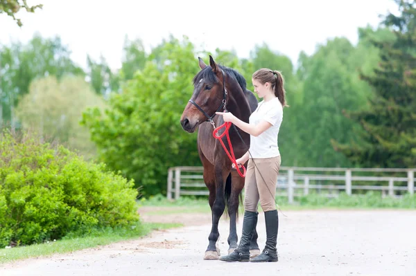 Equestrian owner teenage girl showing horse correct training — Stock Photo, Image