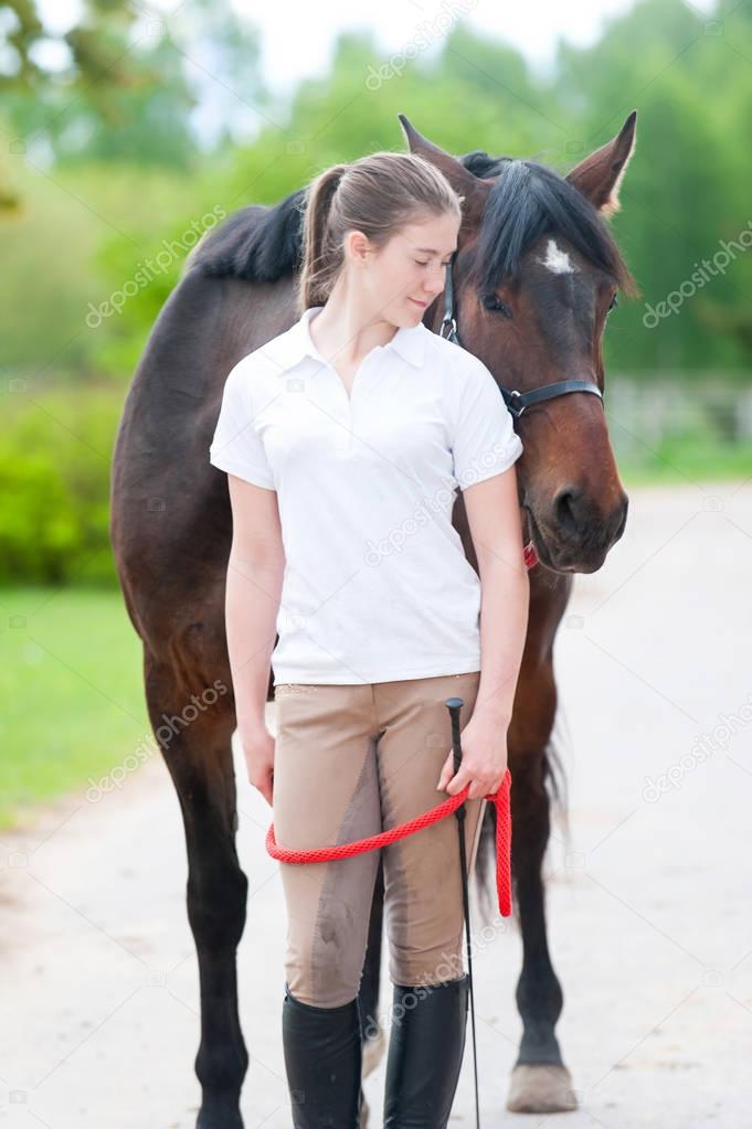 My Best friend. Young teenage girl with her favorite horse.