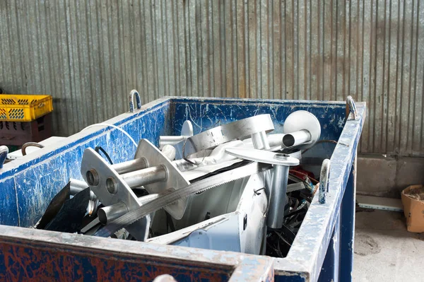 Mitallic container full of industrial iron waste products. — Stock Photo, Image